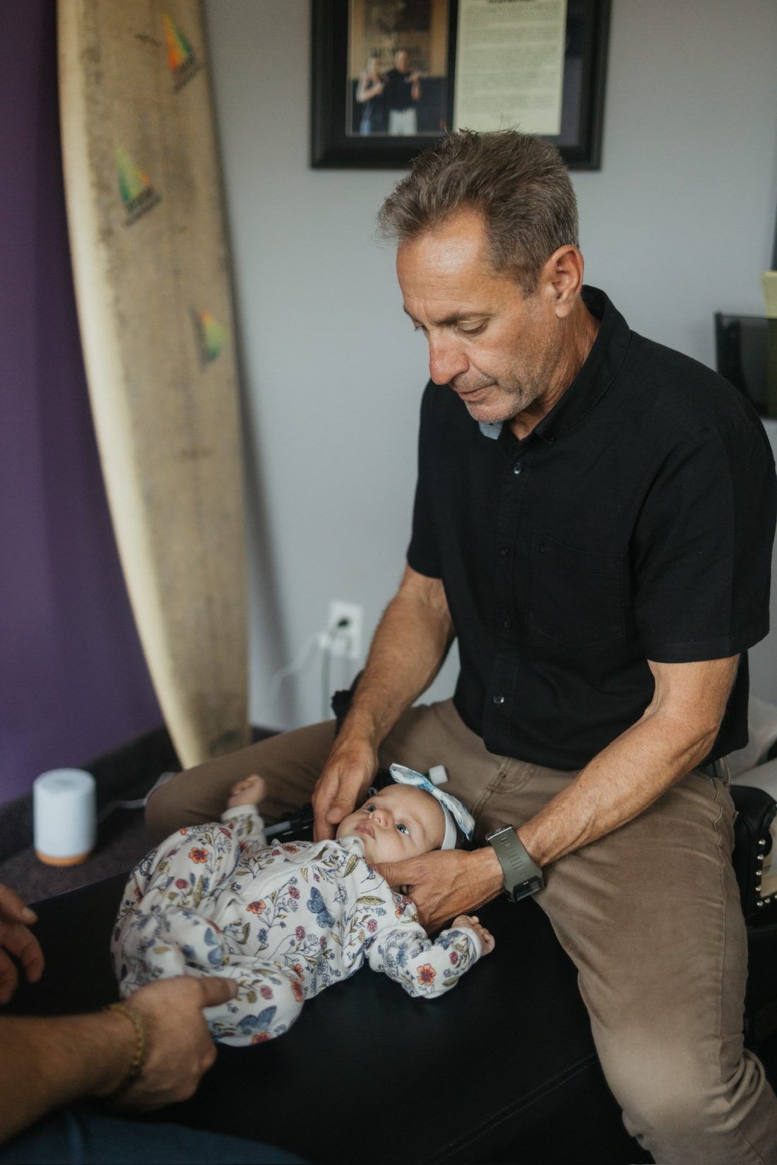 A gentle infant adjustment at DeMoss Chiropractic, Newport Beach