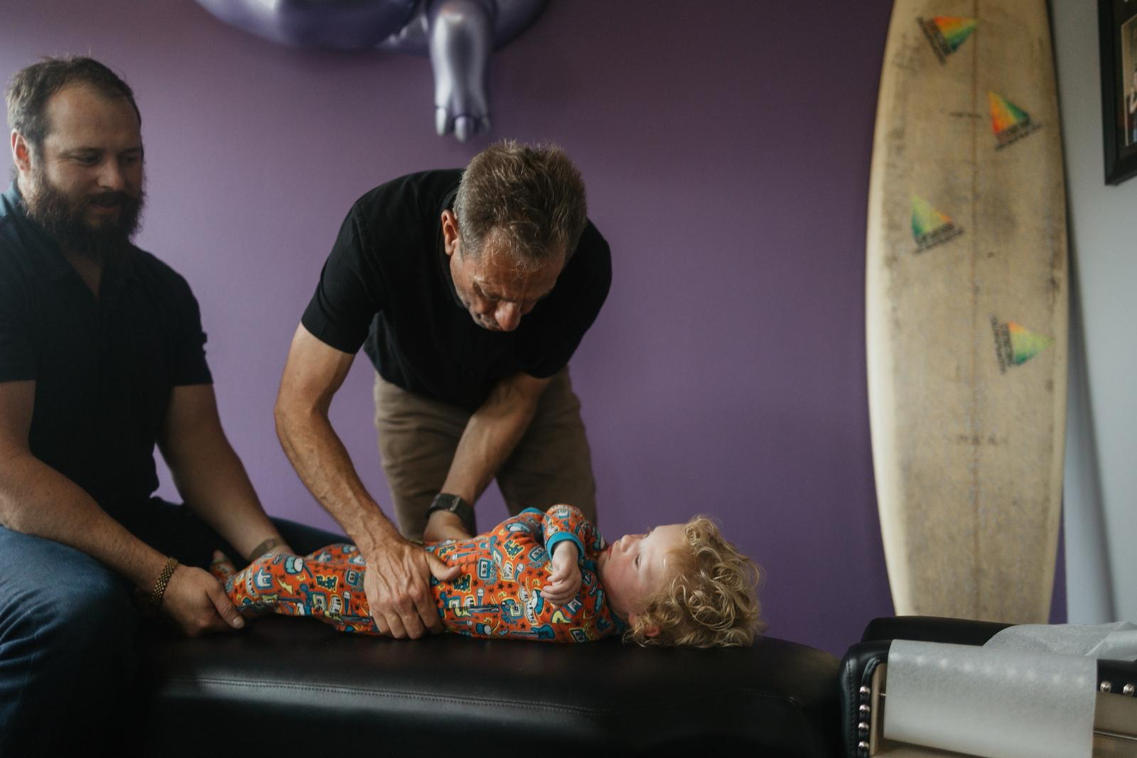 A paediatric adjustment at DeMoss Chiropractic, Newport Beach