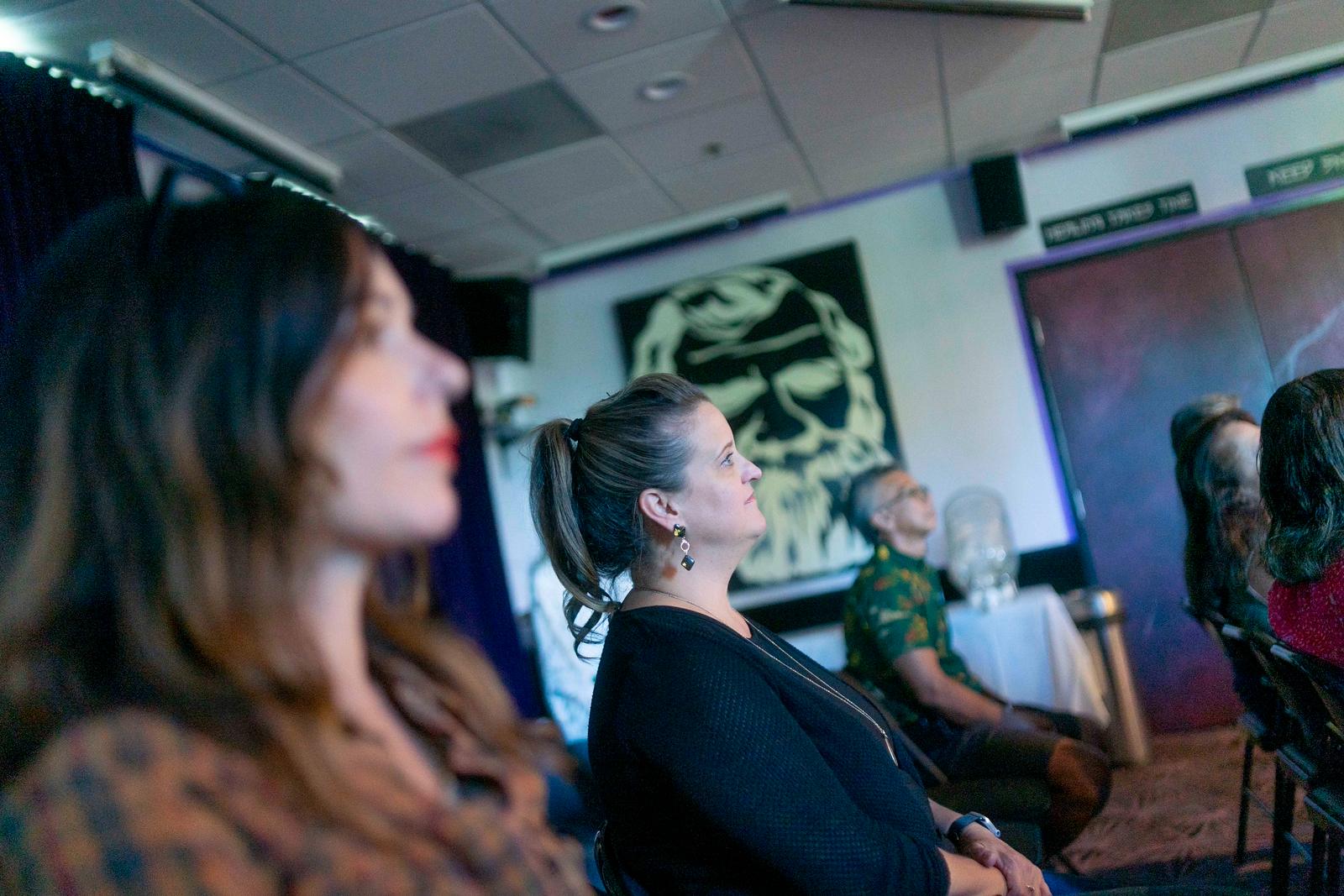 Patients at an evening workshop in the DeMoss Chiropractic office